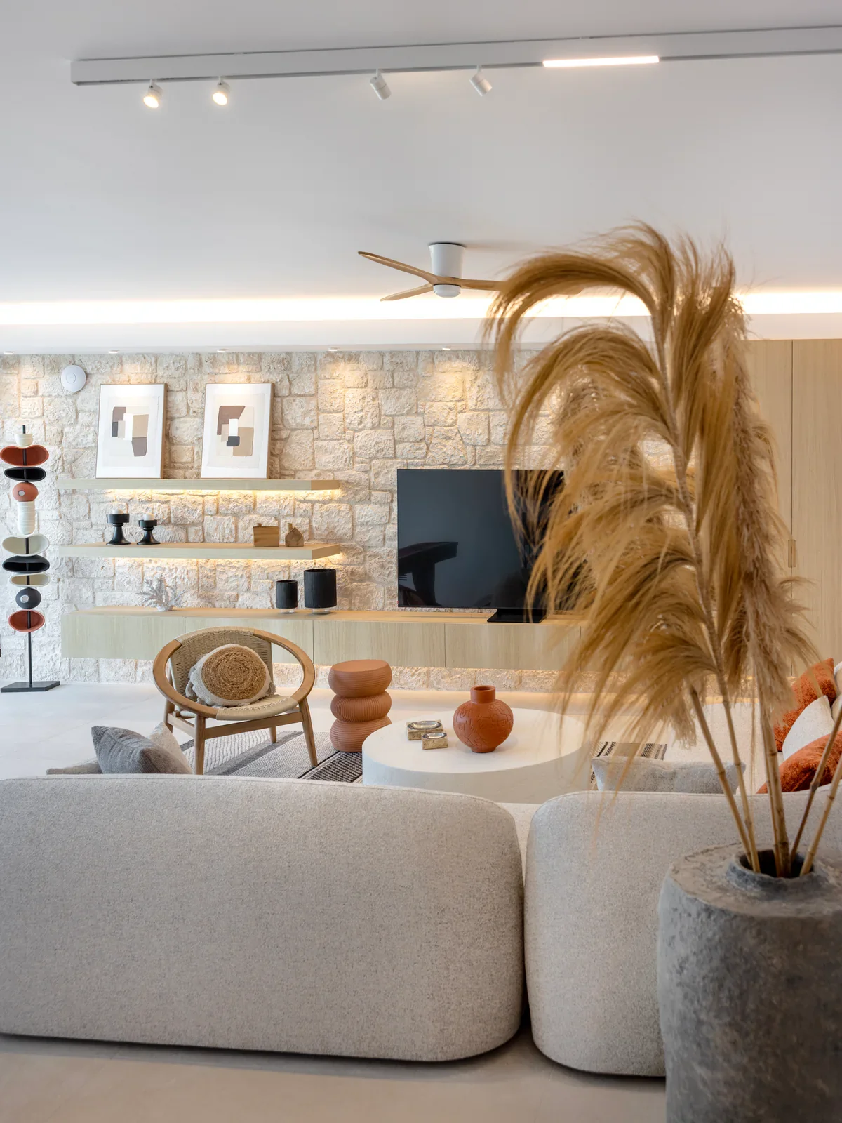 Warm stone-walled living room inside Kyrelia Villa